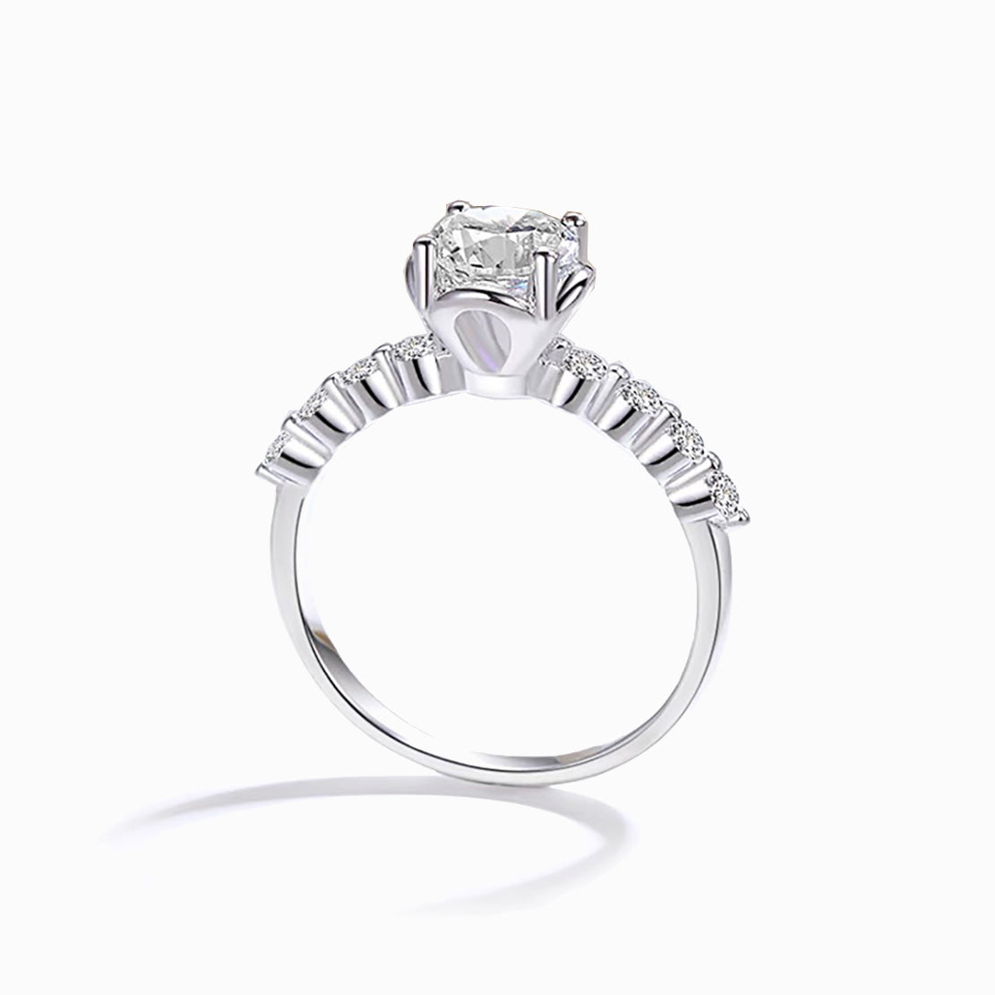 a white gold ring with a princess cut diamond