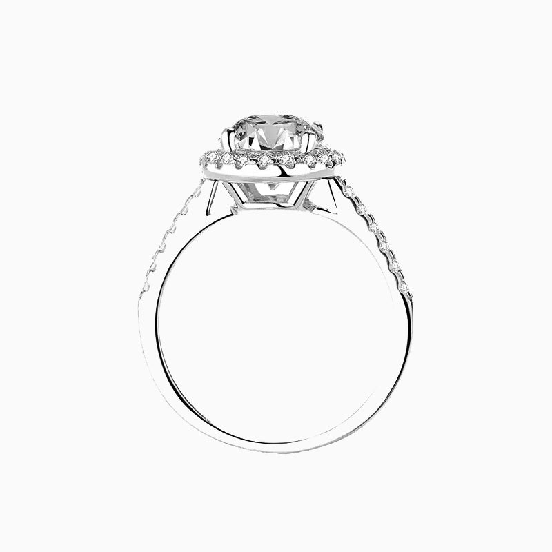 a white gold ring with a diamond center