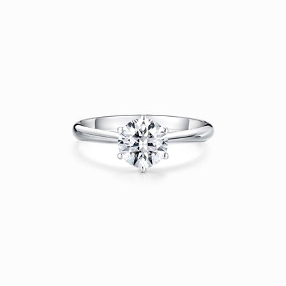a white diamond ring on a white background