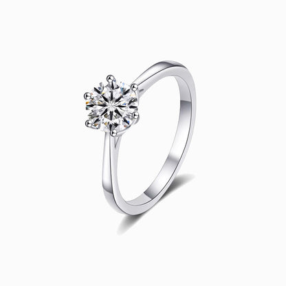a white ring with a single diamond