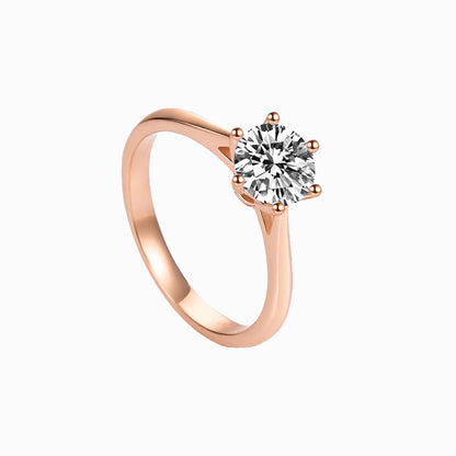 a rose ring with a single diamond
