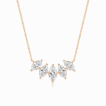 a necklace with three pear shaped diamonds