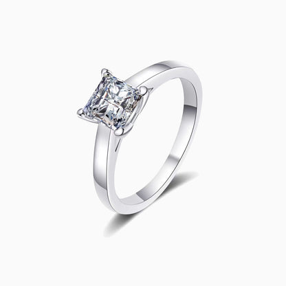 a white ring with a princess cut diamond