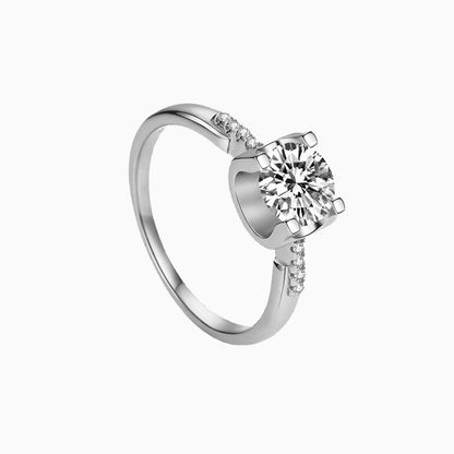 a white ring with a single diamond