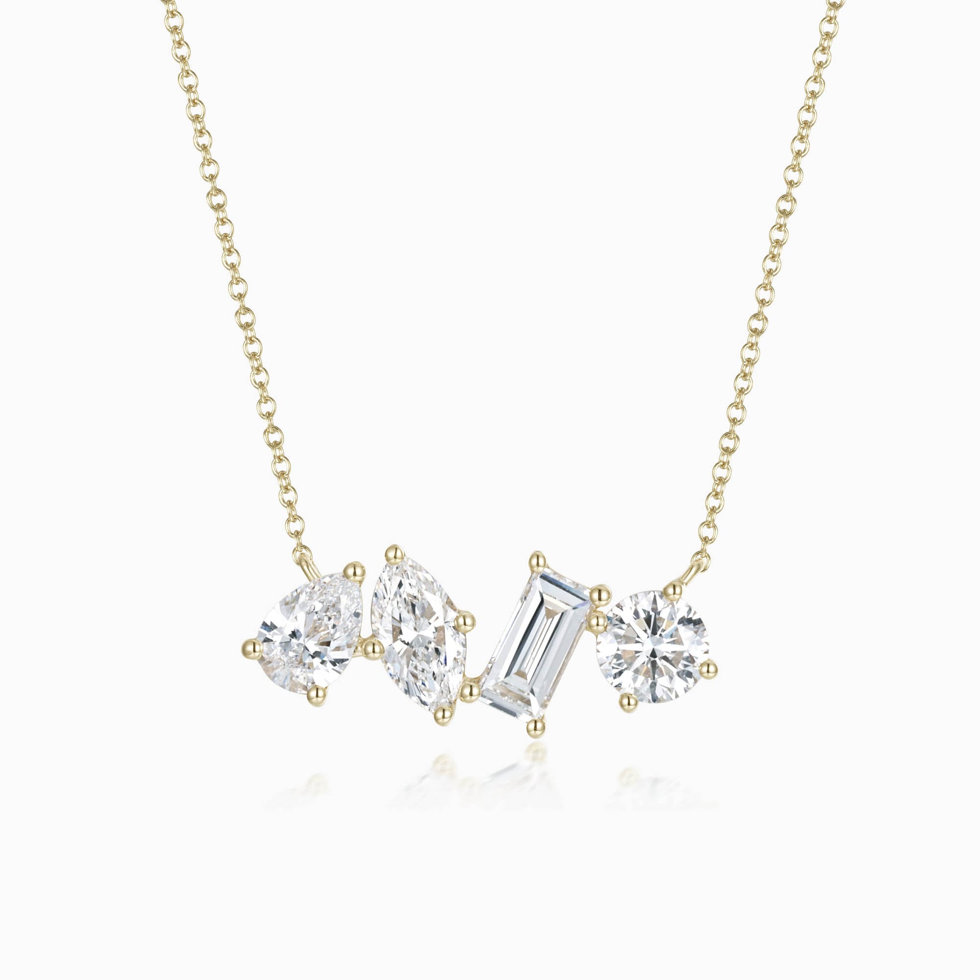 a necklace with three stones on a chain