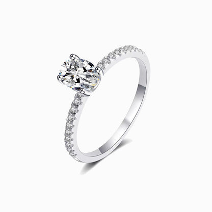 a white ring with a single diamond