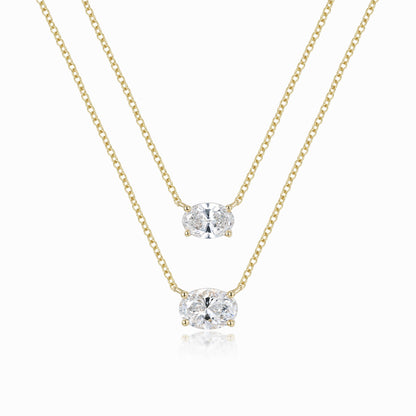 a pair of necklaces on a white background