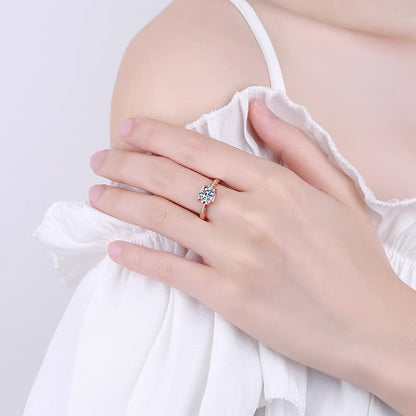a woman's hand with a ring on it