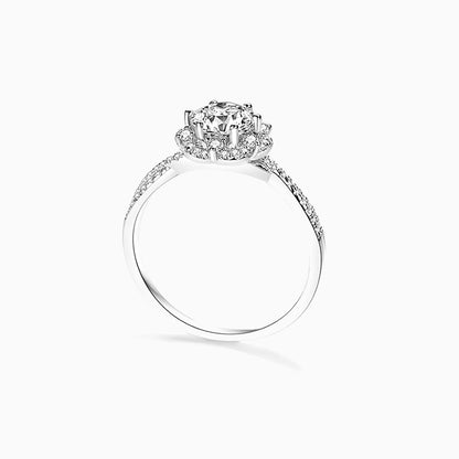 a white ring with a diamond center