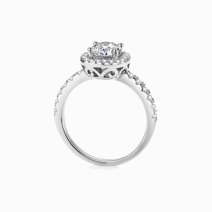 a white ring with a diamond center