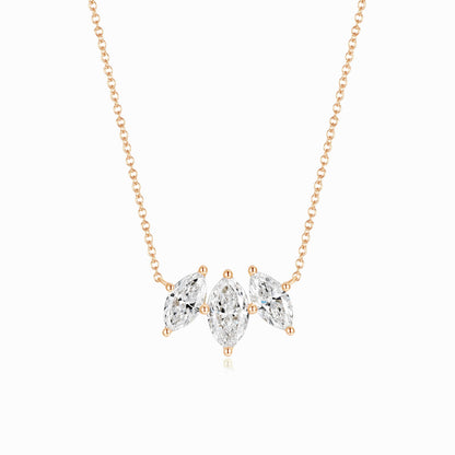 a necklace with three pears on it