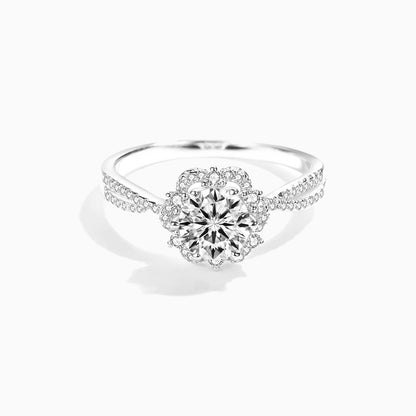 a white ring with a flower design