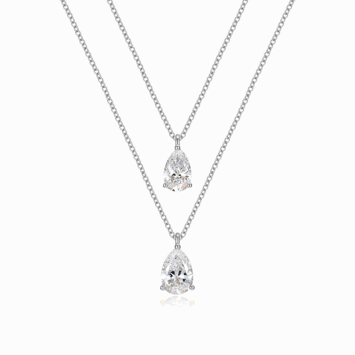 two necklaces with two pear shaped diamonds