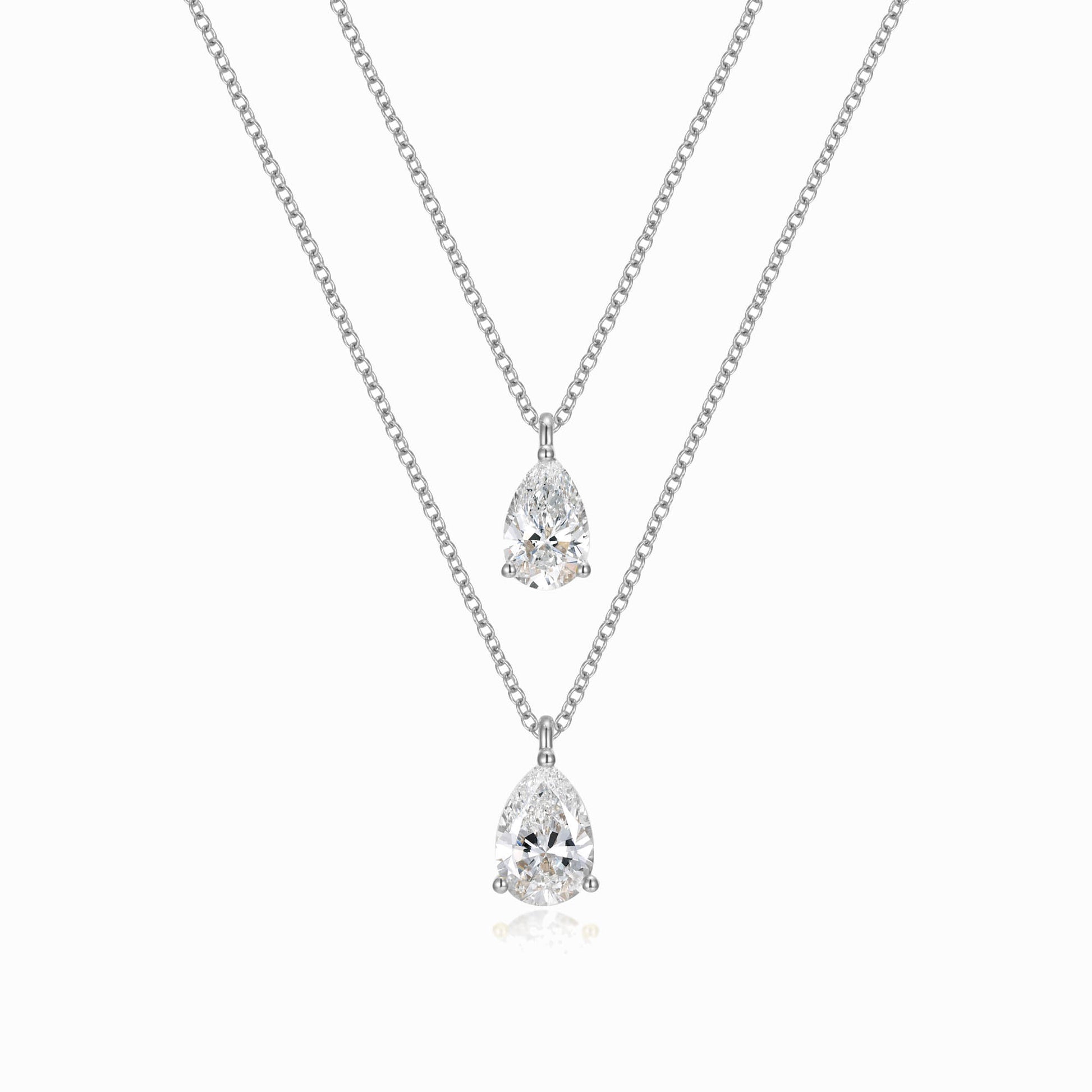 two necklaces with two pear shaped diamonds