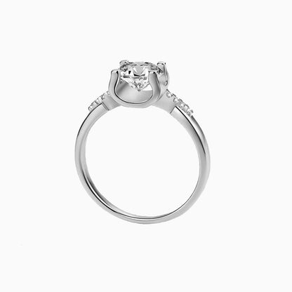 a white ring with a diamond center