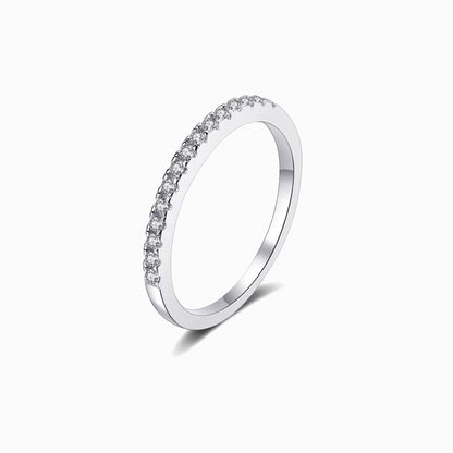a white ring with a row of diamonds