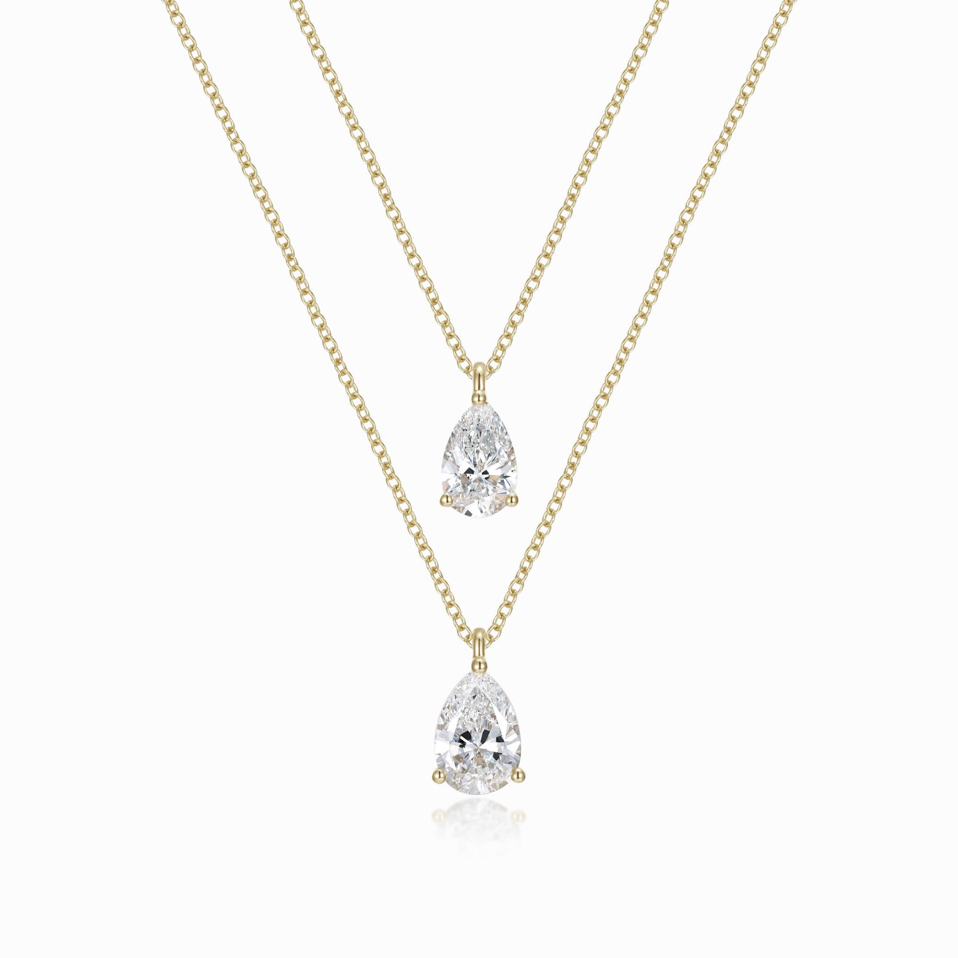 a necklace with two pear shaped diamonds on it