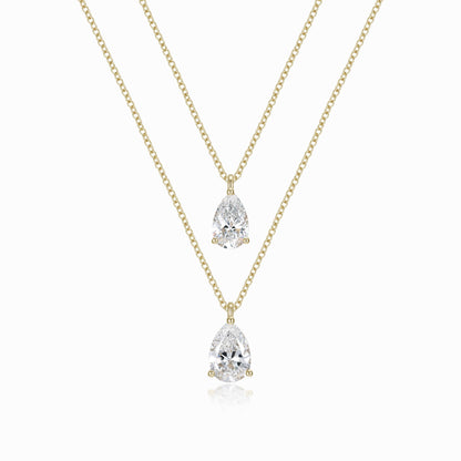 a necklace with two pear shaped diamonds on it