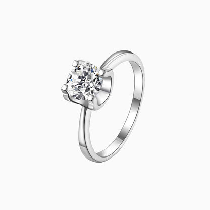 a white ring with a single diamond