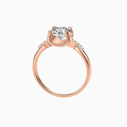 a rose ring with a white diamond