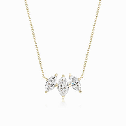 a necklace with three pear shaped diamonds