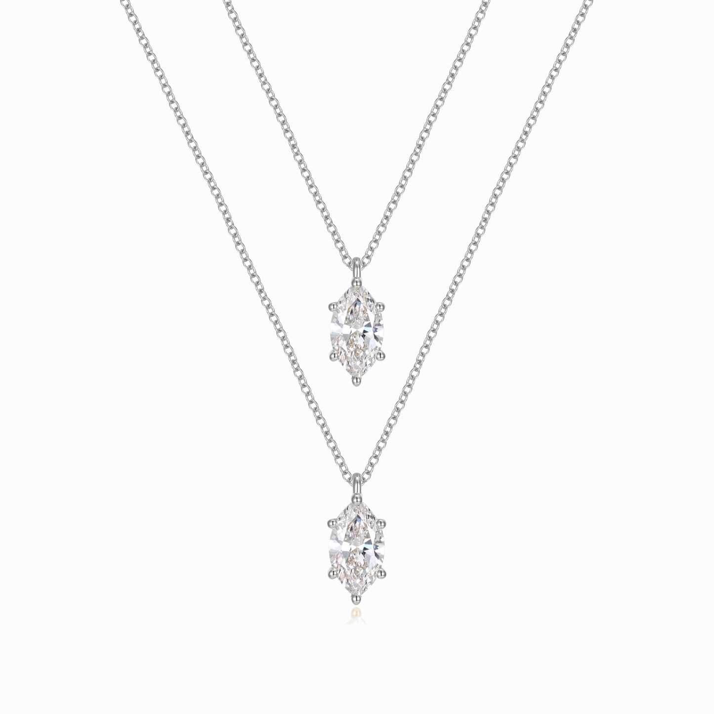 two necklaces with diamonds on a white background
