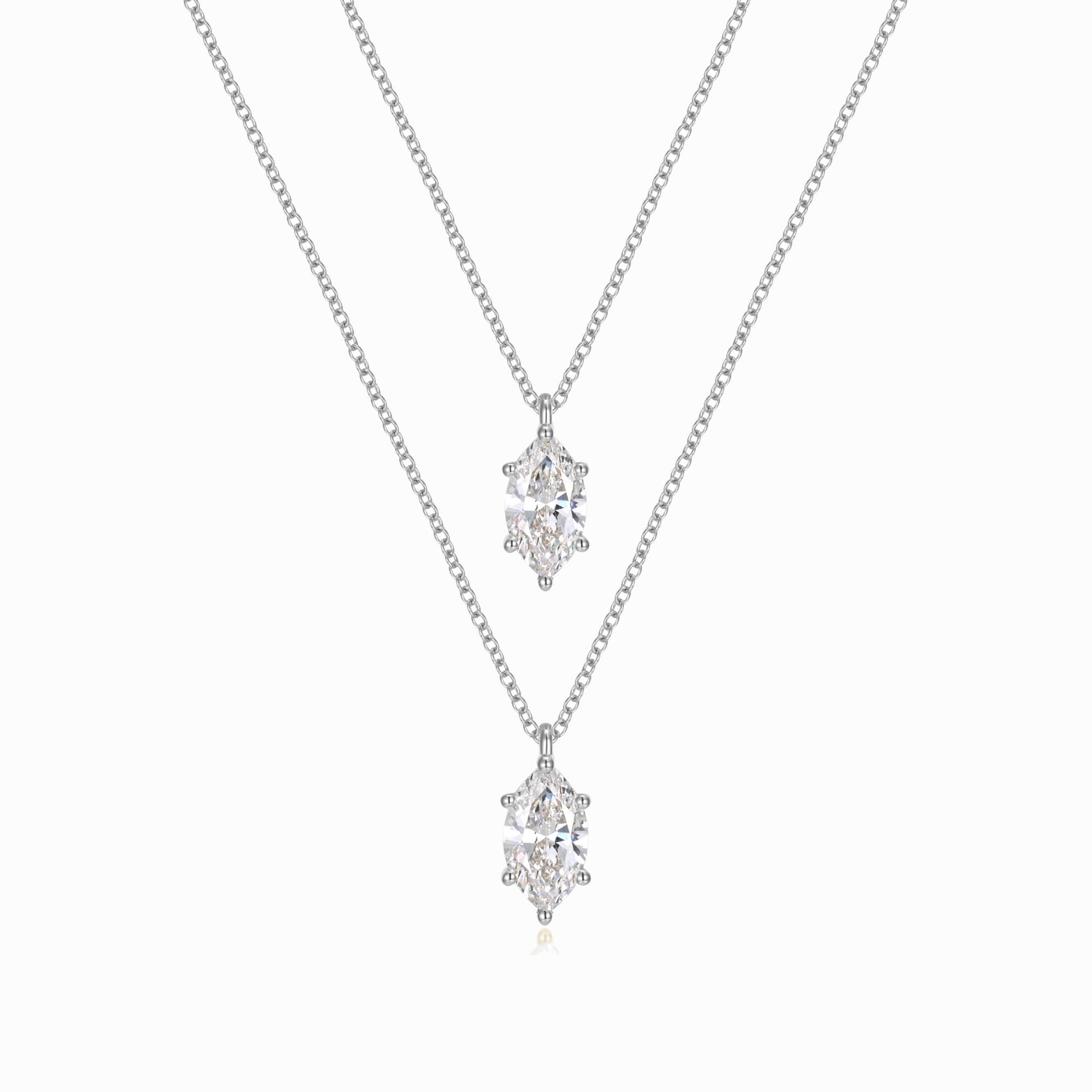 two necklaces with diamonds on a white background
