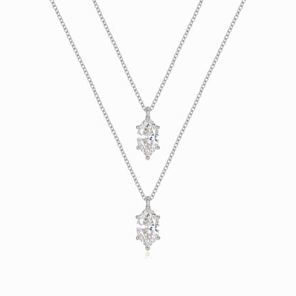 two necklaces with diamonds on a white background