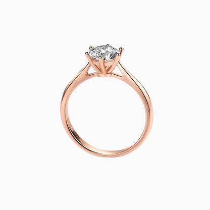 a rose engagement ring with a single diamond