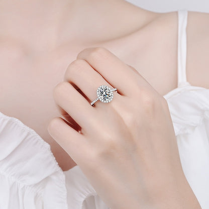 a woman's hand with a diamond ring on it