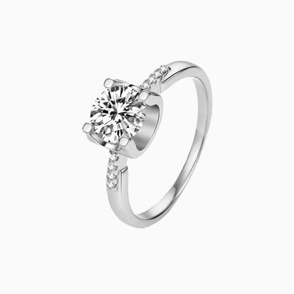 a white ring with a single diamond