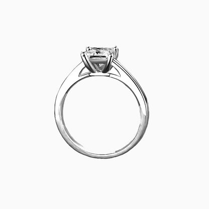 a white ring with a princess cut diamond
