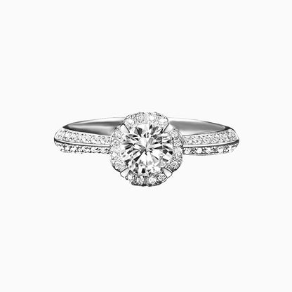 a white ring with a diamond center
